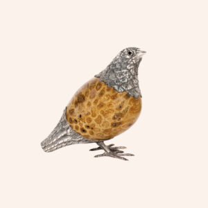 Quail with fossilized coral egg